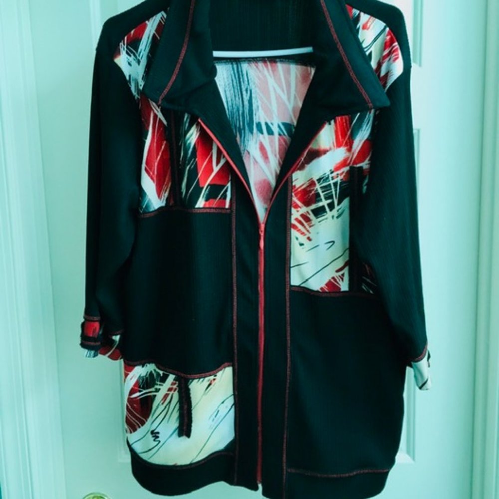 A multi-colored casual jacket with a zippered front, size IX, Picadilly Fashions